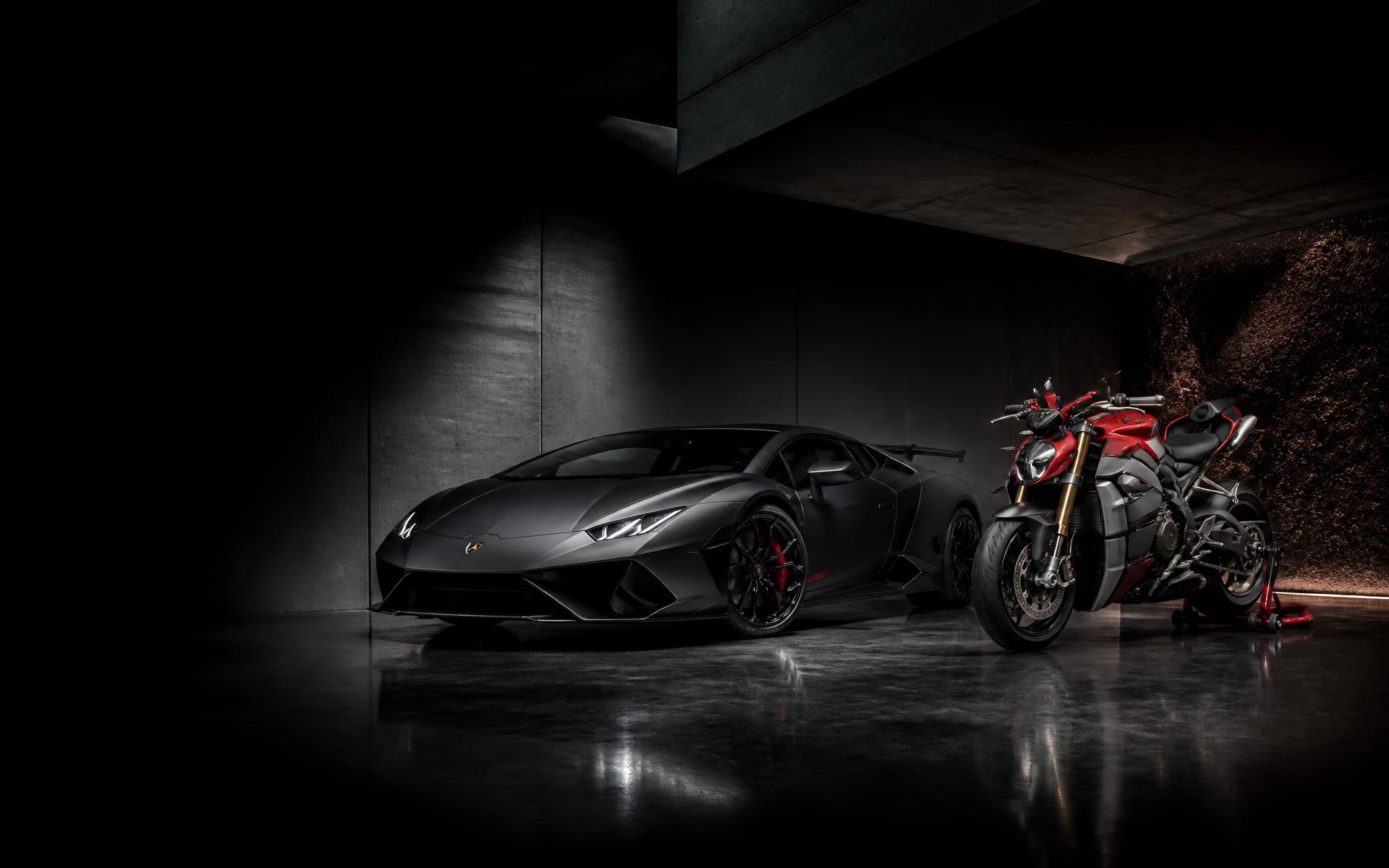 Supercar and superbike side by side in a private garage
